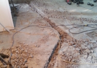 Breaking up concrete for plumbing